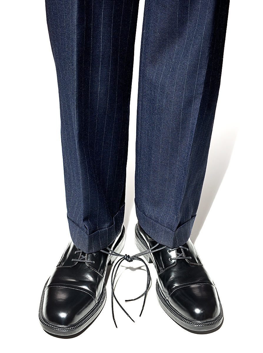 Businessman shoes hobbled conceptual photo by John Kuczala