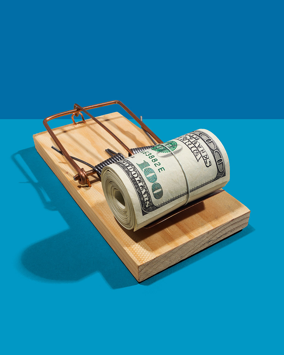 Mouse trap baited with cash photo-Illustration by John Kuczala